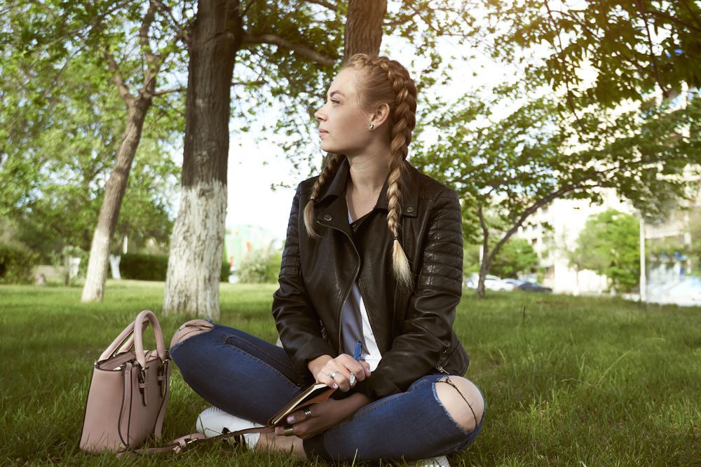 Natural home remedies for anxiety, a woman sitting in a park