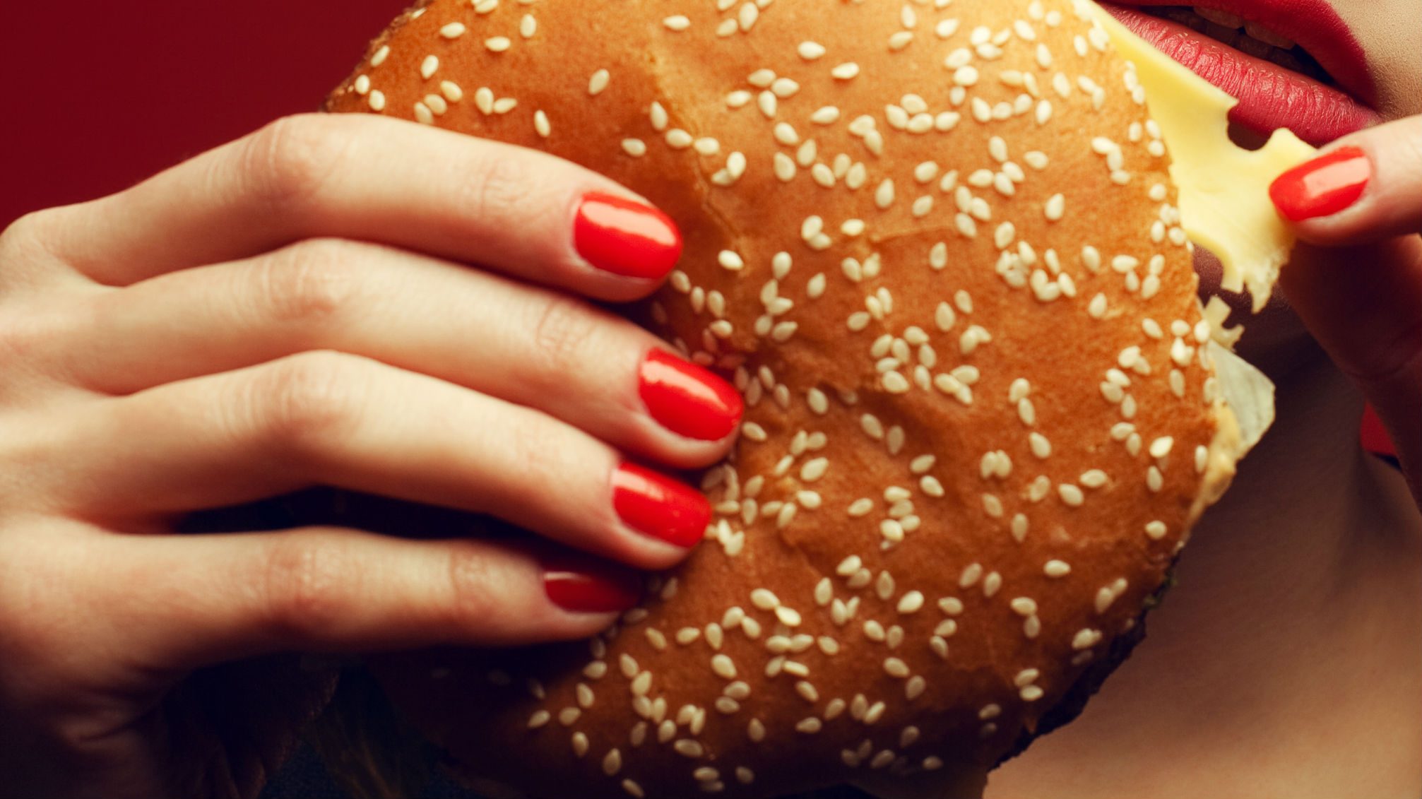 cheat meals good, a burger with manicured nails