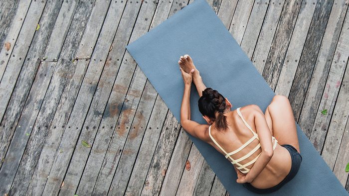 morning yoga routine, woman on yoga mat