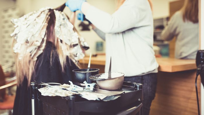 woman with shiny hair at the salon