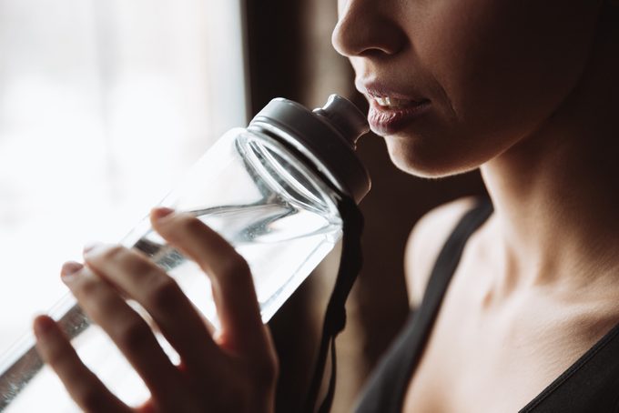 woman drinking water_ increase metabolism 