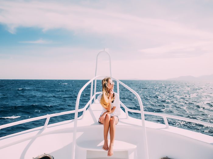 motion sickness,Woman,relaxing,nose,of,white,yacht,in,sea