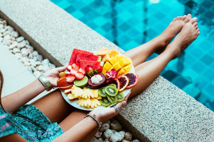 woman eating healthy fruit