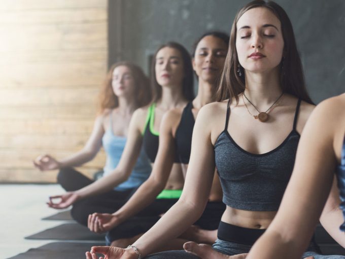 Yoga Teacher Training, young women in a yoga class