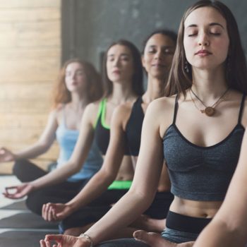 Yoga Teacher Training, young women in a yoga class
