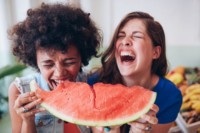 lose weight this summer_women eating watermelon