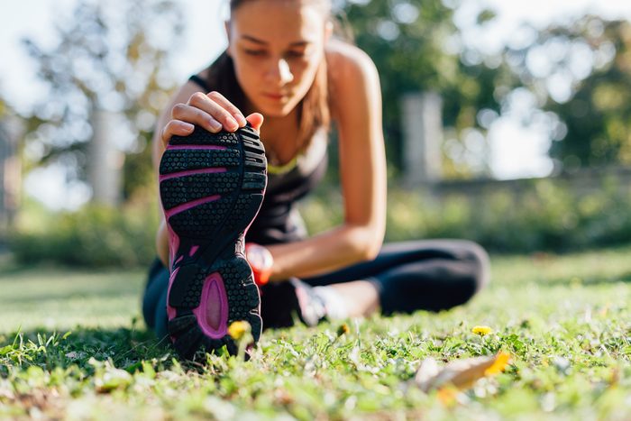 lose weight this summer_woman stretching 