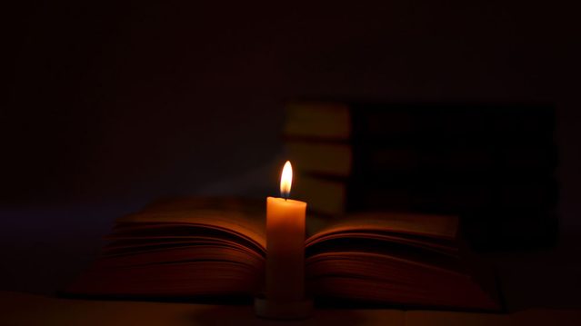 the history of the G Spot, a book with a candle