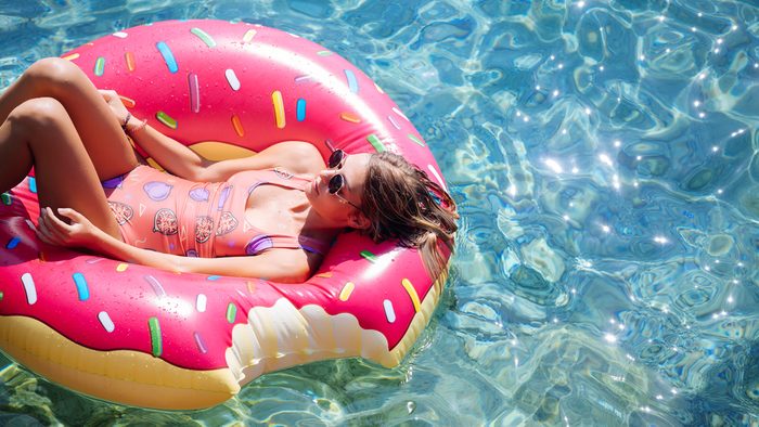 after waxing care woman swimming in donut