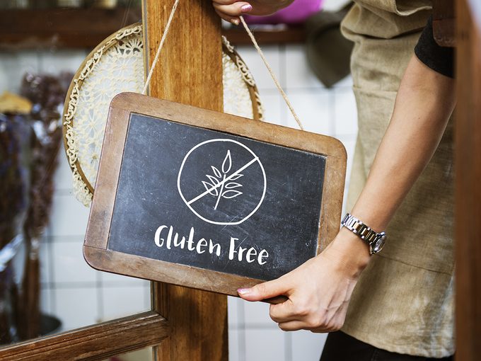 Sex and celiac disease, woman holding gluten-free sign
