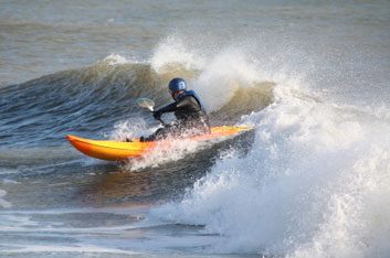 Surf kayaking and waveskiing