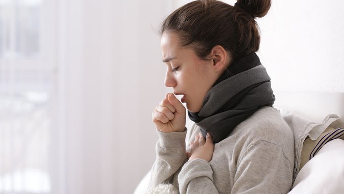 When to call in sick, woman coughing