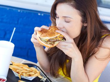 woman eating burger habit