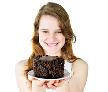 woman indulge in cake