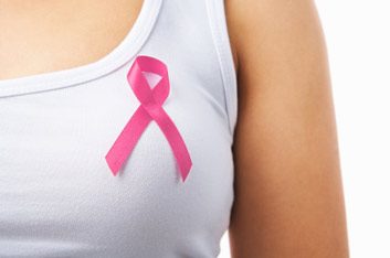 woman wearing breast cancer pink ribbon