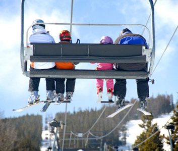 family on chair lift