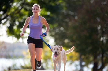 woman running with dog fitness