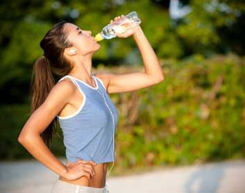 woman exercise hydration water break