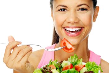 healthy woman eating salad