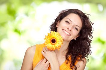 happy women outdoors with flower