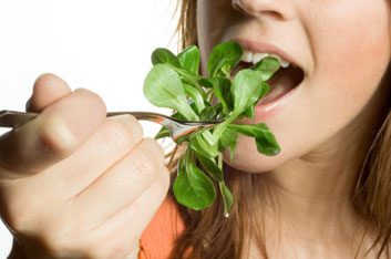 woman eating lettuce
