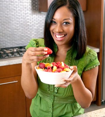 woman eating fruit strawberries