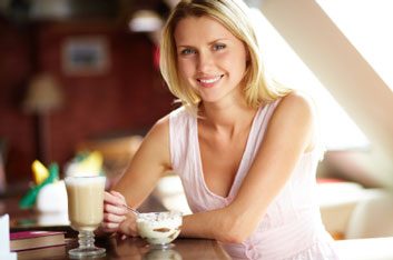 woman eating coffee snack