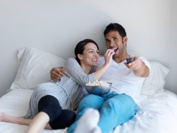 tv snacking couple