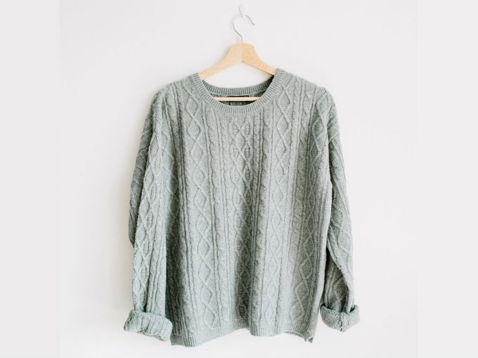flattering oversized sweater, grey sweater on a hanger