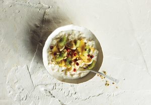 Creamy Rice Breakfast Bowl With Tropical Fruits And Pistachios