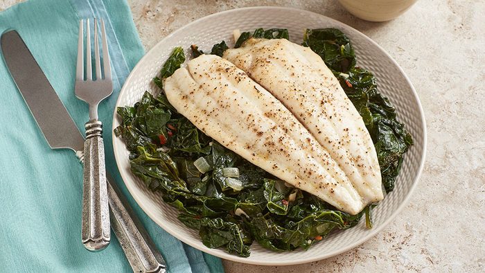 Delicious-looking plate of white fish and kale