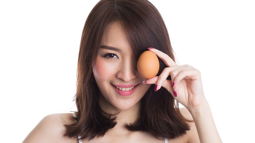 Woman holding an egg