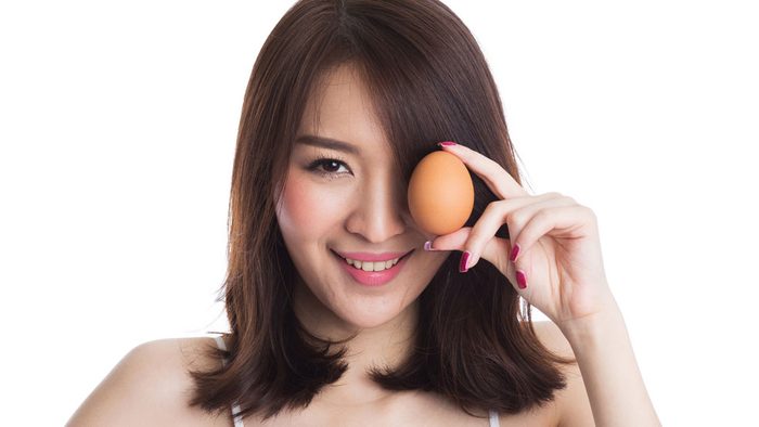 Woman holding an egg