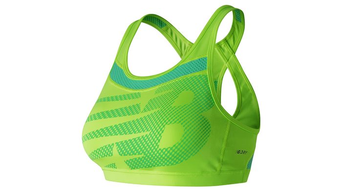 green sports bra with racer back support and NB-logoed front