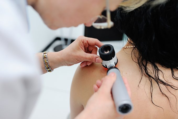 dermatologist-and-patient-skin cancer warning signs 
