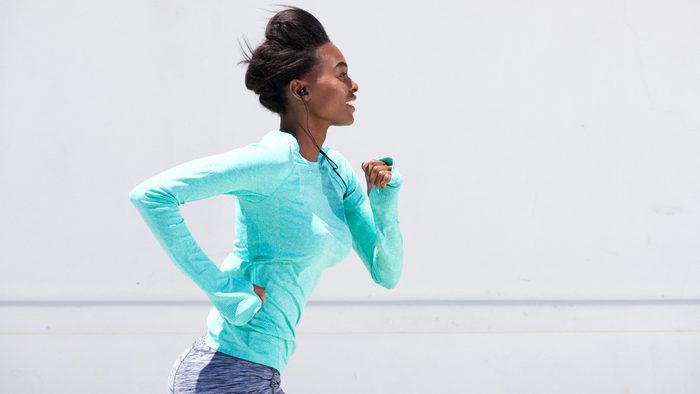 Ruining hearing, woman runs with earbuds
