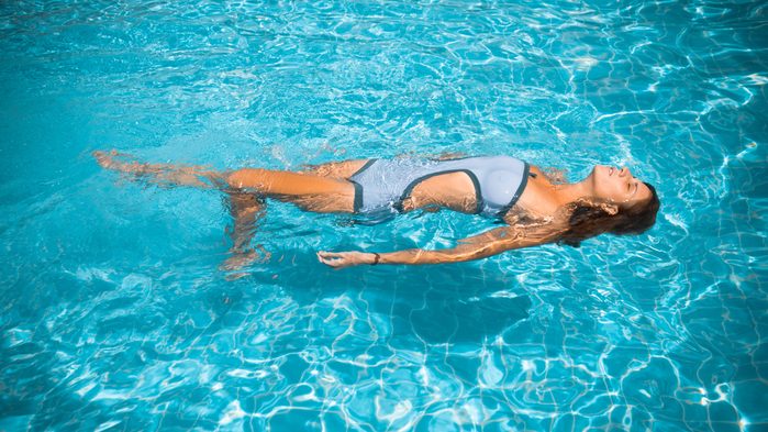 Ruining hearing, woman swimming with water past her hairline