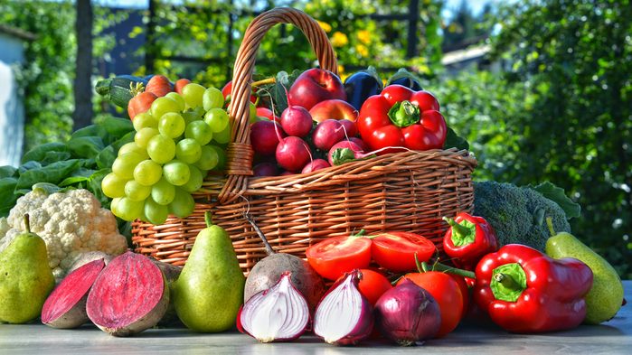 Ballerinas eat whole foods, a basket of fruits and veggies