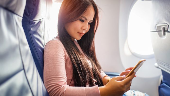Ruining hearing, woman on a plane about to embark