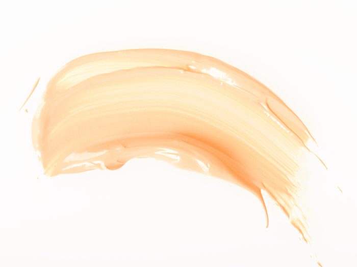 Smoothing on tinted moisturizer can help you look less tired
