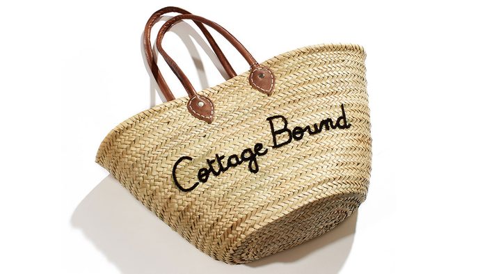 summer layering tote, a straw bag with "cottage bound" written on the front