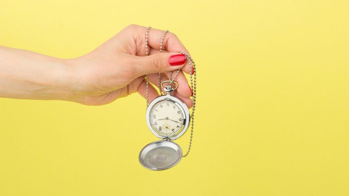 diagnosed with melanom, a woman holding a pocket clock