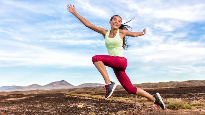 eat before a run when you're hyper, a woman jumping during her run