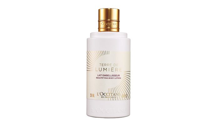 skin saver, bottle of L'occitane Lait Terre de Lumiere body lotion