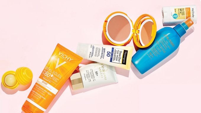 right way to wear sunscreen, a flat lay of sunscreen bottles