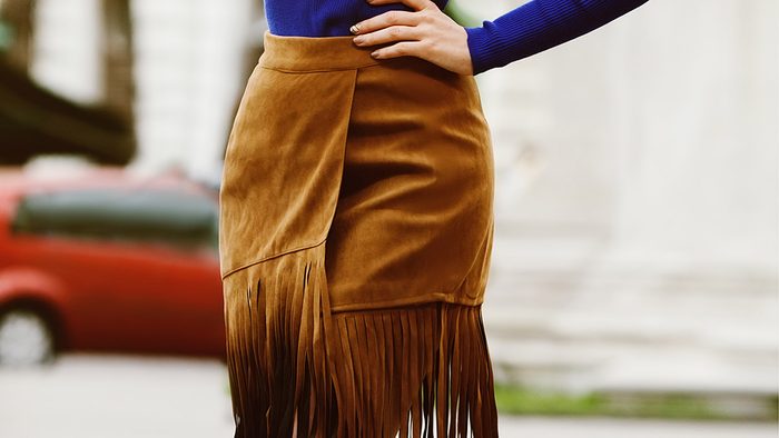 Fall wardrobe, woman wearing fringe skirt
