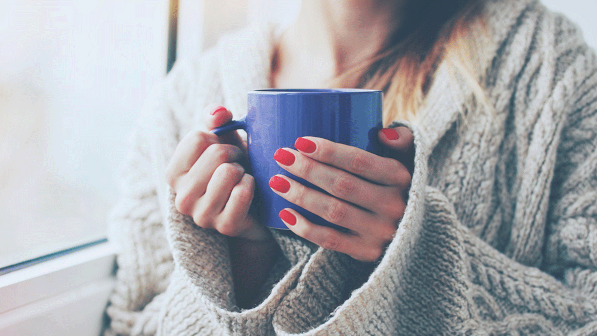 Drinking Black Tea, woman holding a mug
