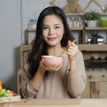 foods for great skin, a woman eating soup
