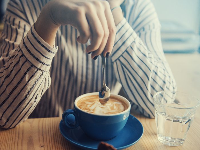 healthier coffee, woman stirring coffee