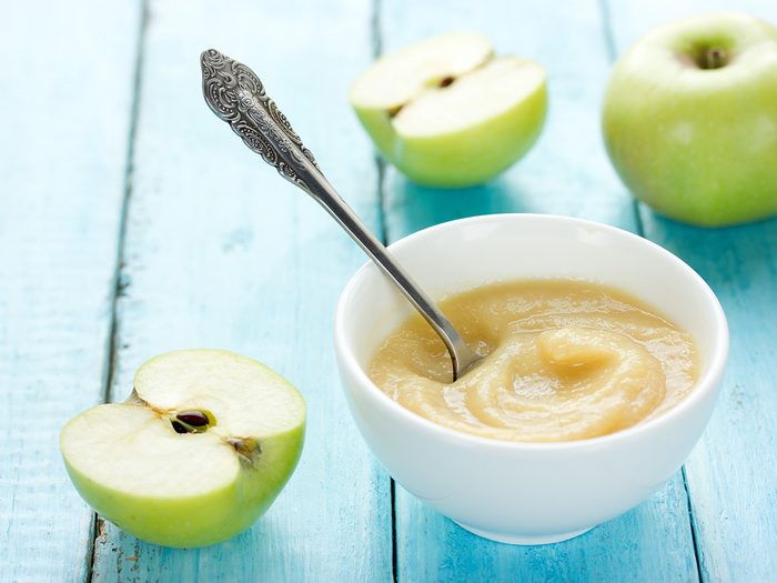 Butter substitute, bowl of applesauce and fresh apples
